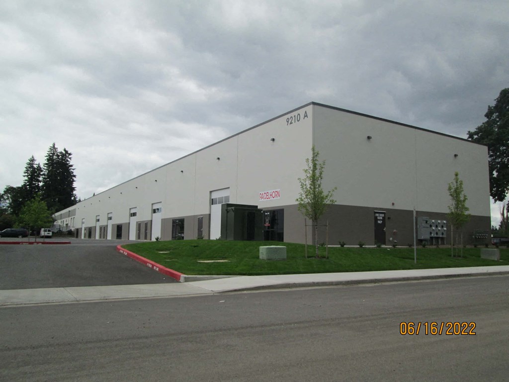 a large building with a street in front of it
