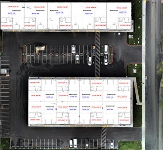 an aerial view of a parking lot full of shipping containers