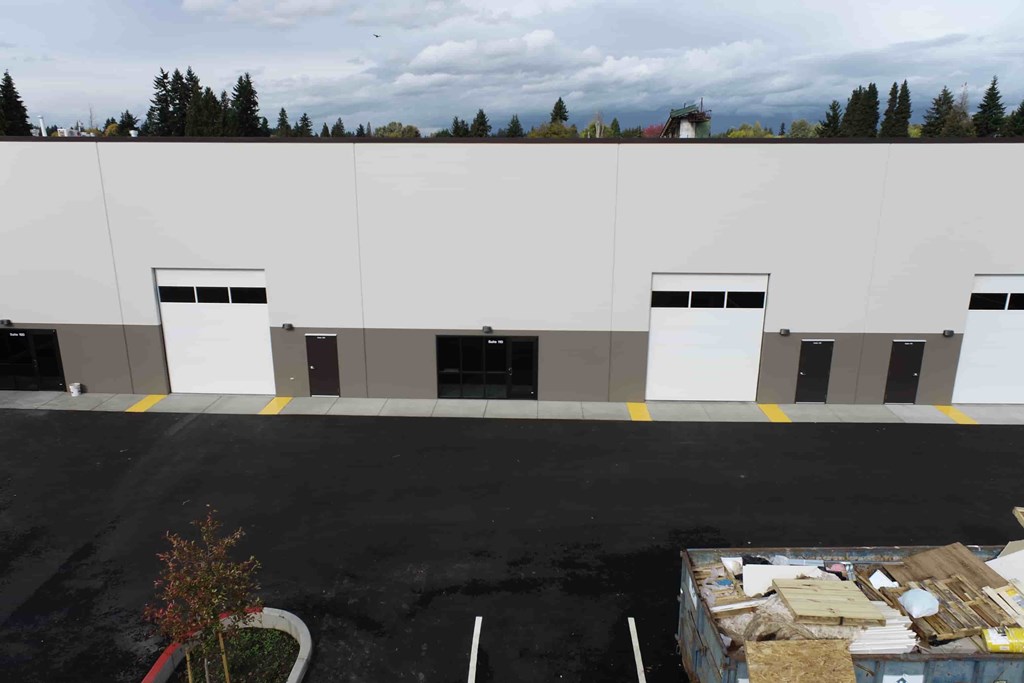 a large white building with black and white doors