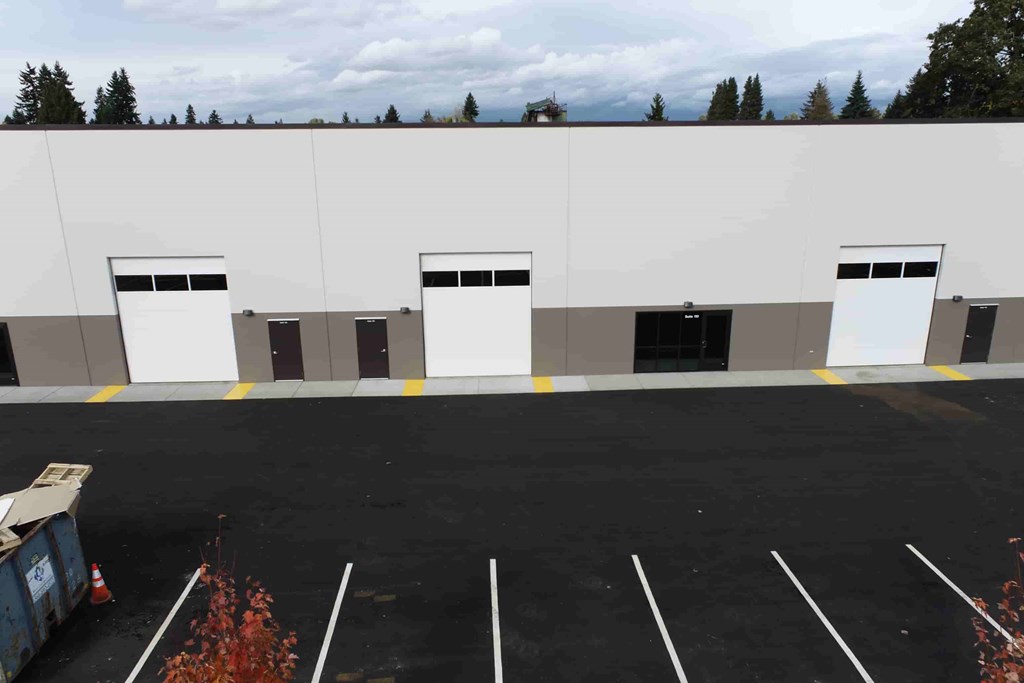 an empty parking lot in front of a building