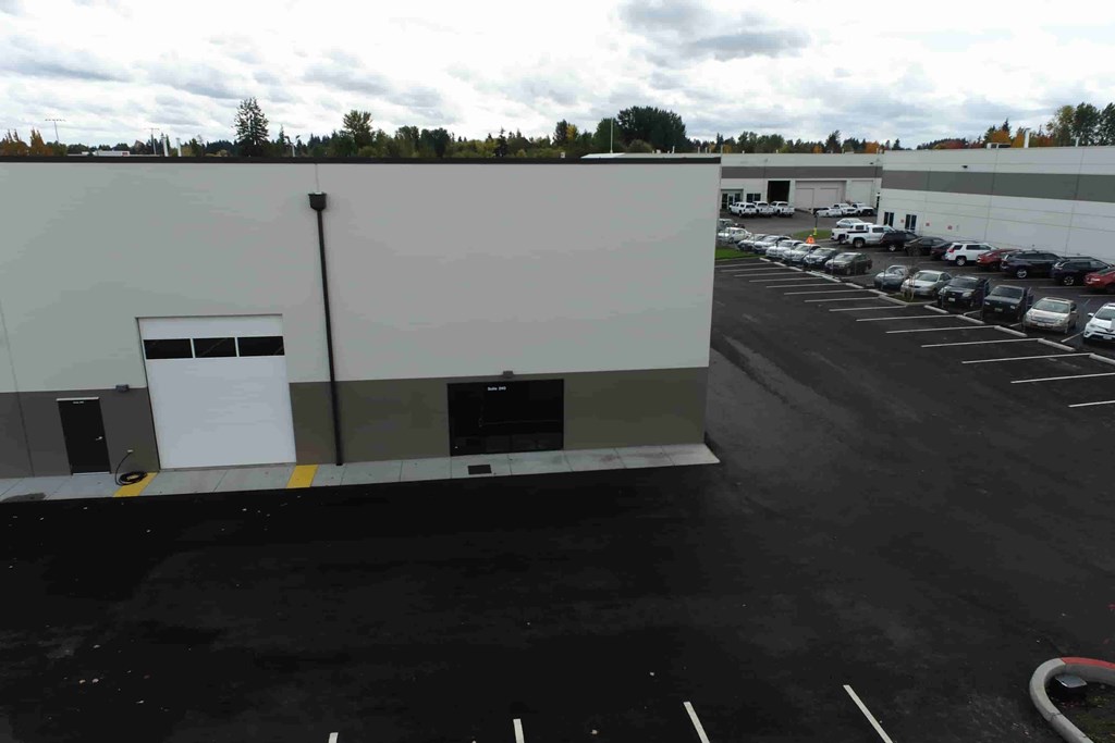 an empty parking lot in front of a building