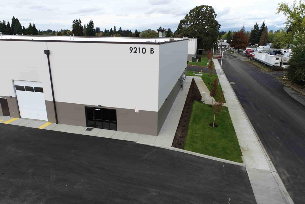 an office building with a street in front of it