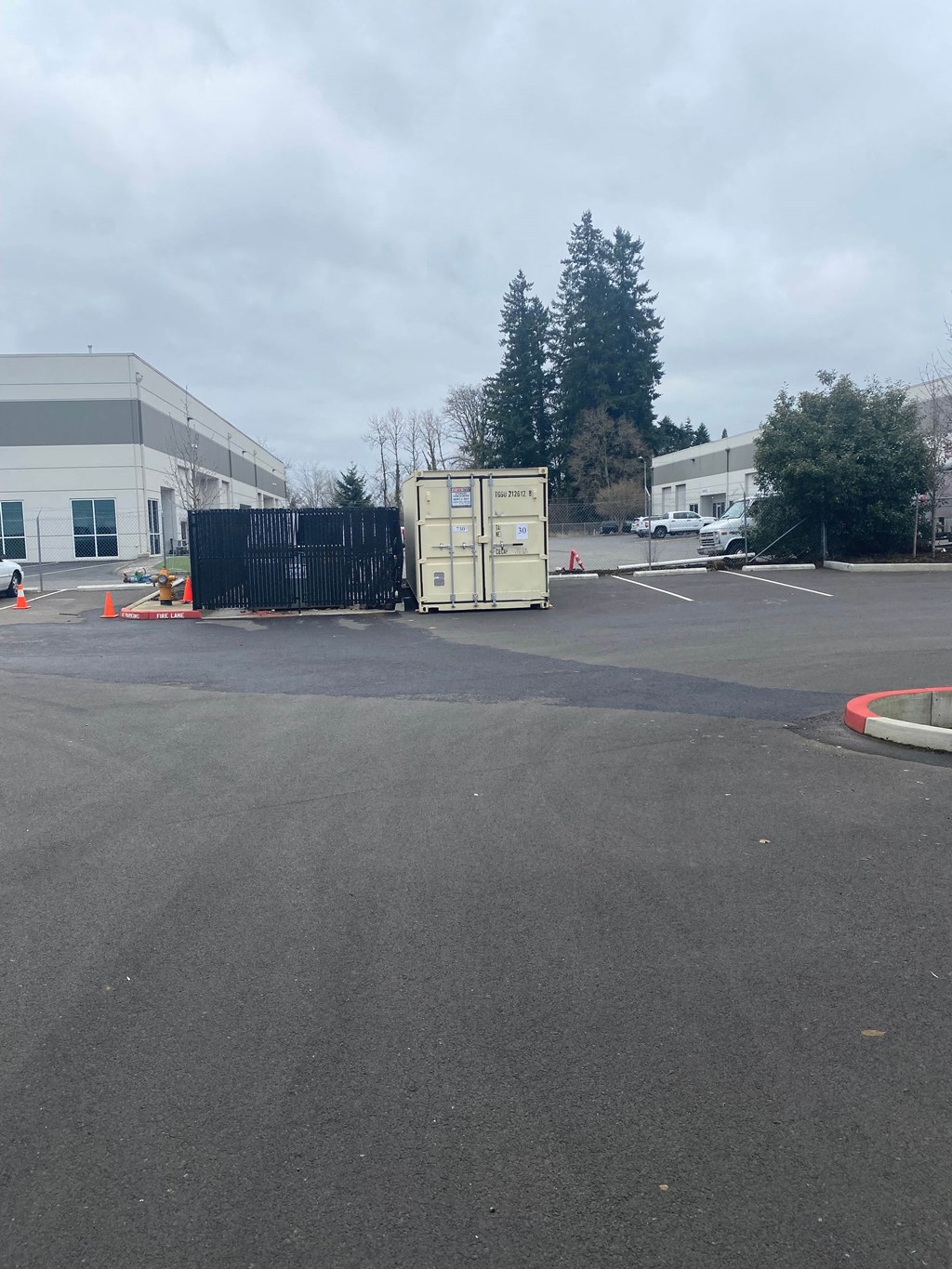 a refrigerator in the middle of a parking lot