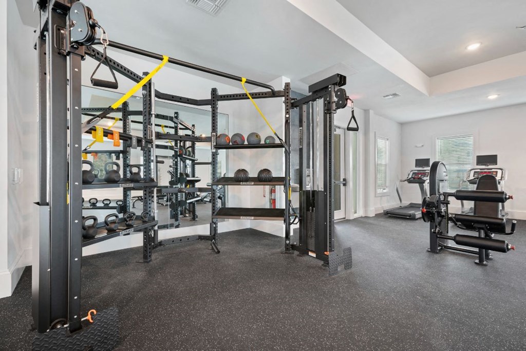 the home has a gym with weights and equipment