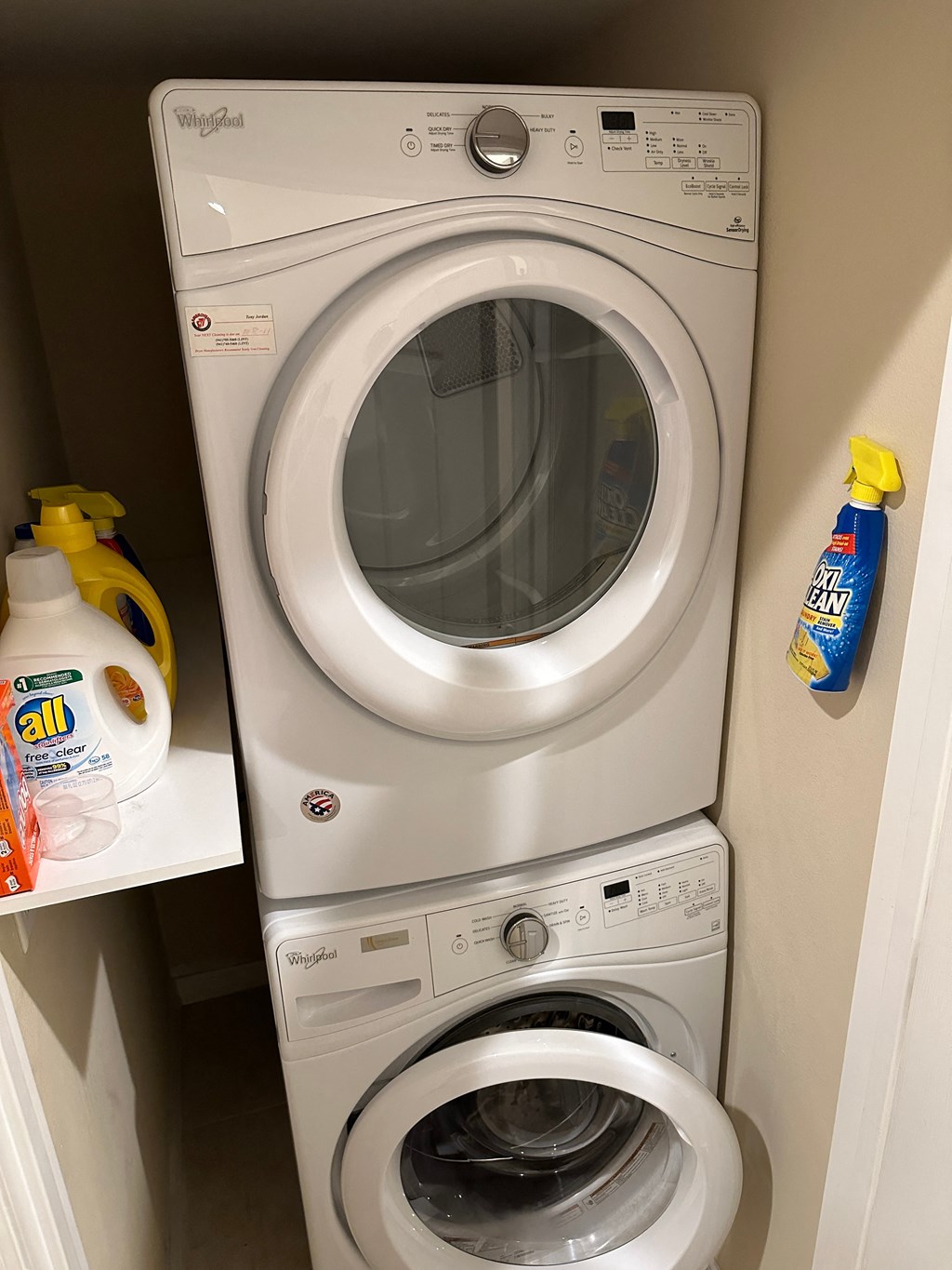 the washer and dryer in the bathroom of a hotel room
