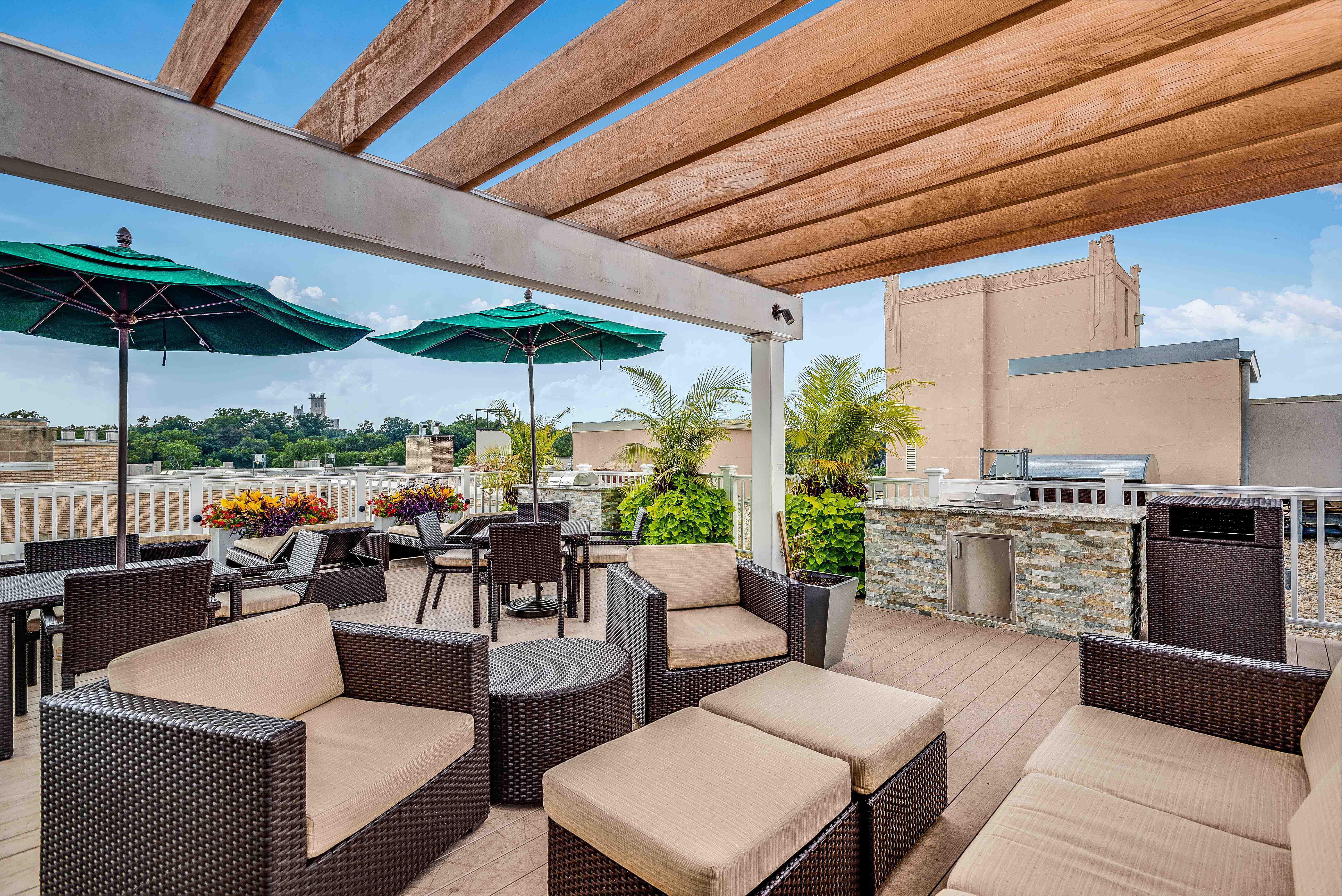 a patio with tables and chairs and umbrellas