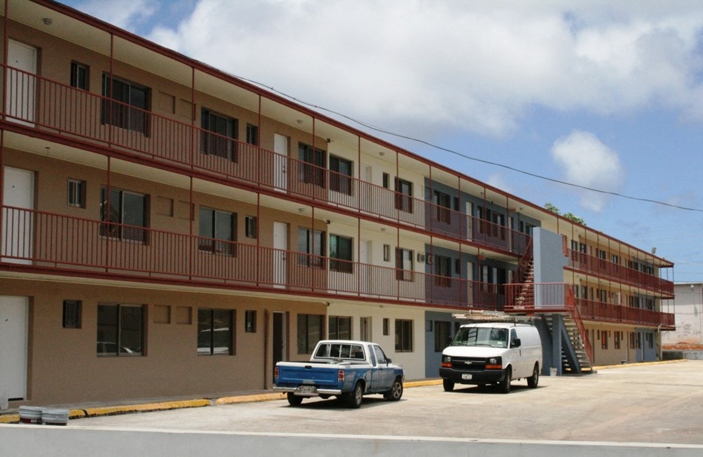a building with trucks parked in front of it