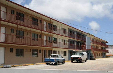 a building with trucks parked in front of it