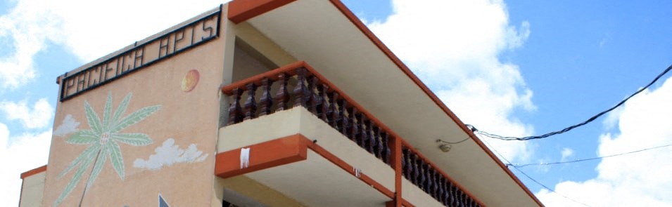 a building with a palm tree painted on the side of it