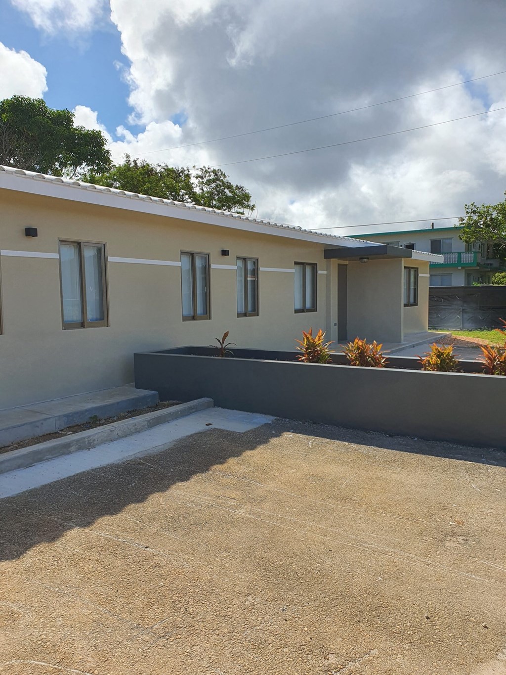a view of the front of a house from the driveway