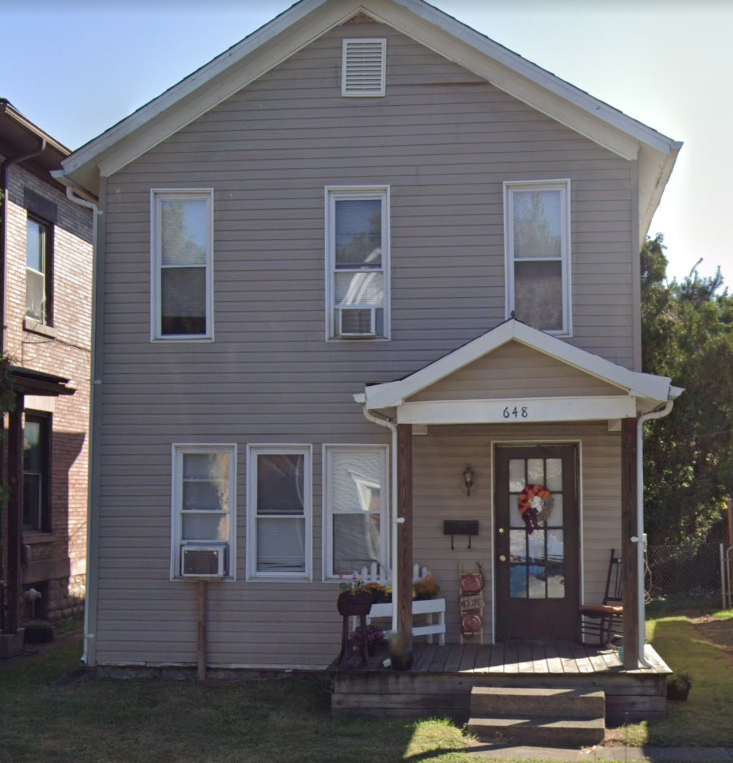 the front of our house with a porch