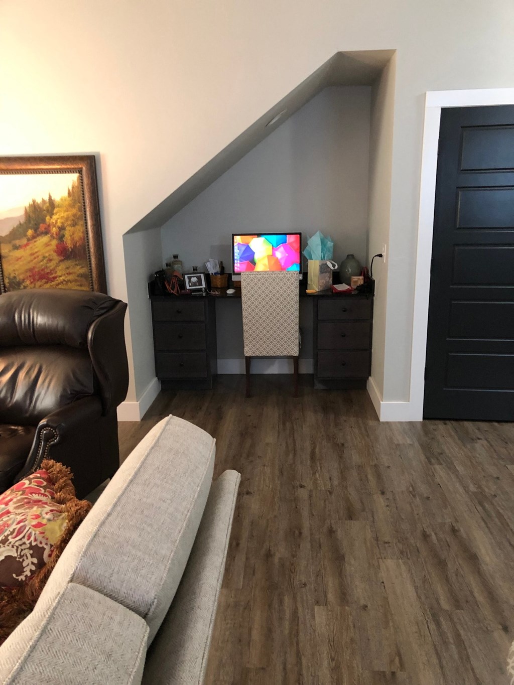 a living room with a couch and a tv