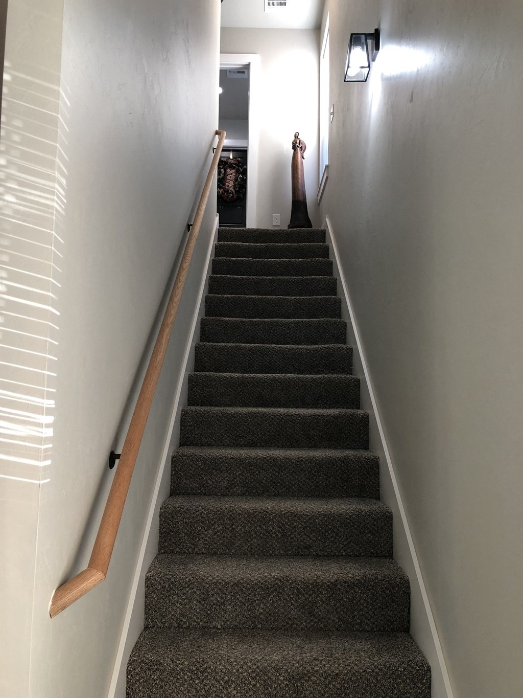 a flight of stairs with a person standing at the bottom