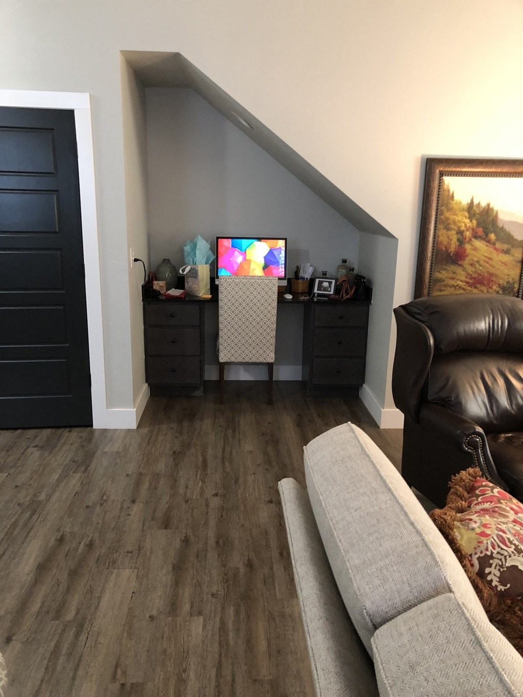 a living room with a couch and a tv