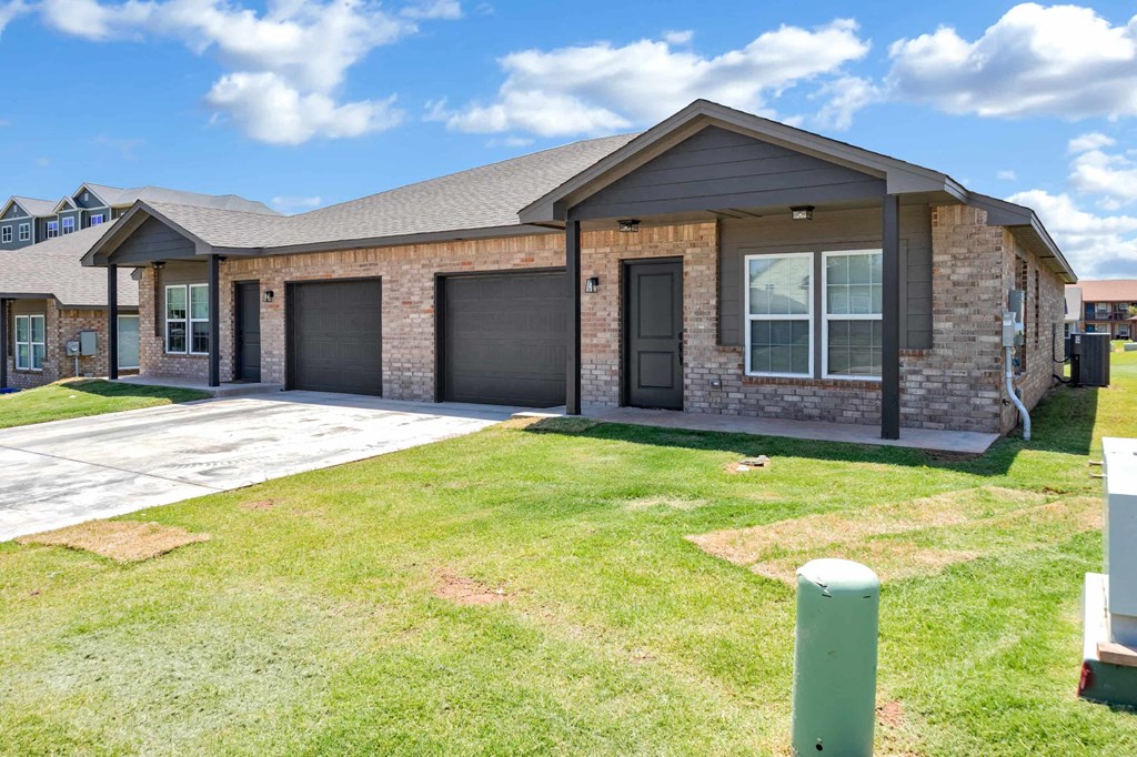 a house with a driveway and a front yard