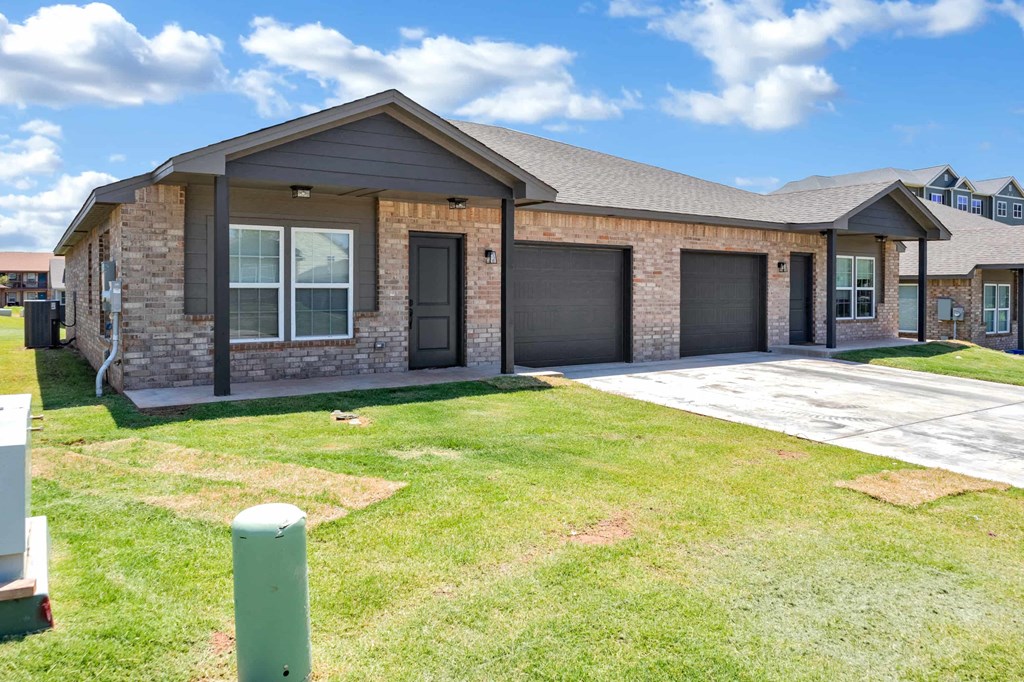 a house with a driveway and a front yard