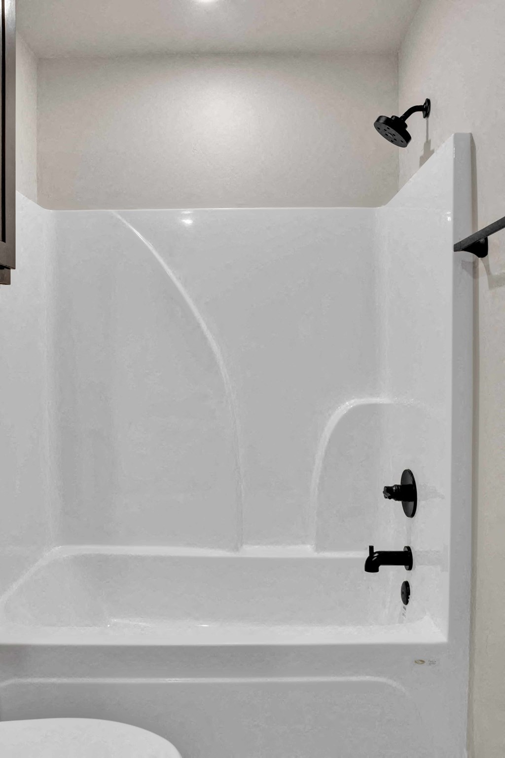 a white bathroom with a tub and a sink