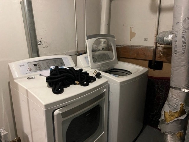 a kitchen with a microwave on top of a washing machine
