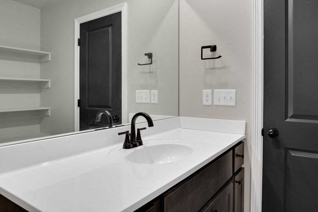 a bathroom with a sink and a mirror