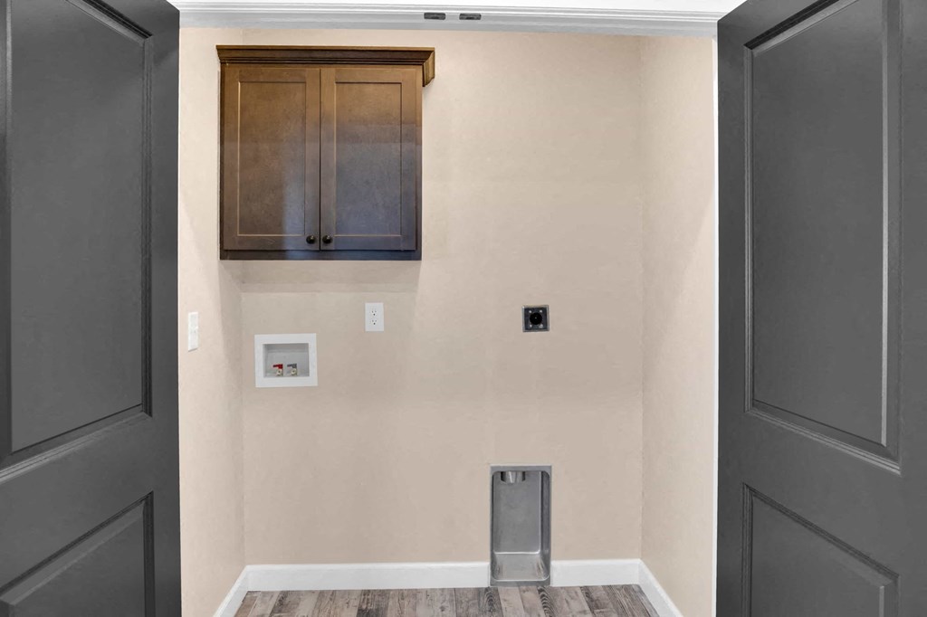 a room with a door and a cabinet on the wall