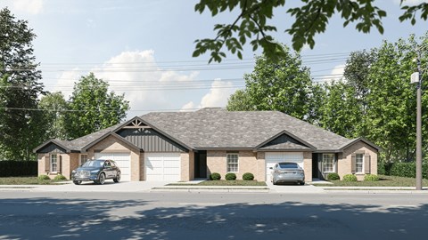 a house with two cars parked in front of it