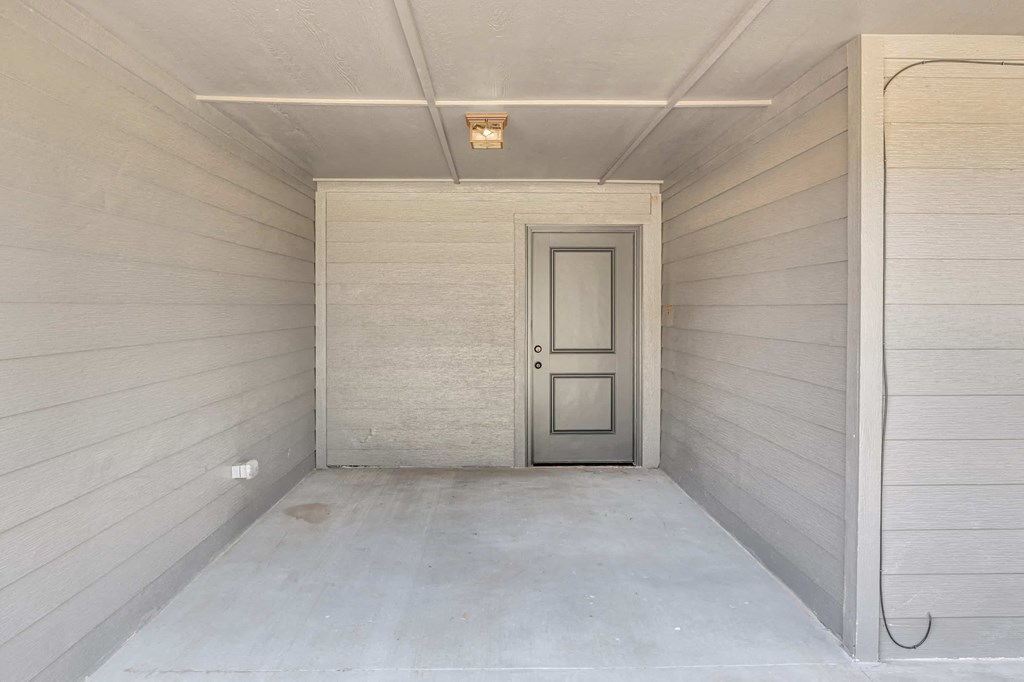 a door in the middle of a hallway in a building
