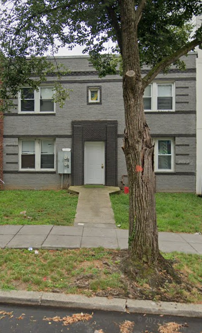 a house with a tree in front of it