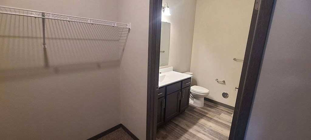a bathroom with a toilet and a sink and a shower