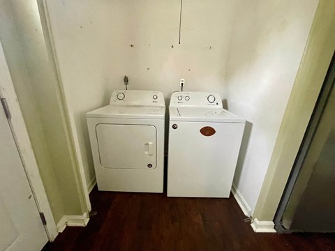A white sink and toilet in a small bathroom.