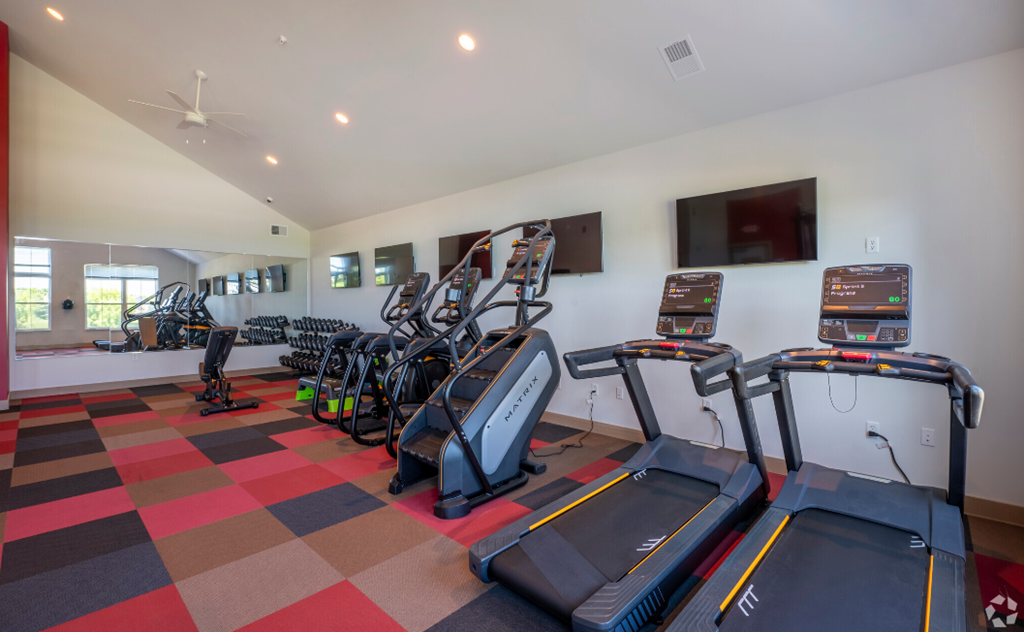 cardio equipment in the gym at the monarch club apartments
