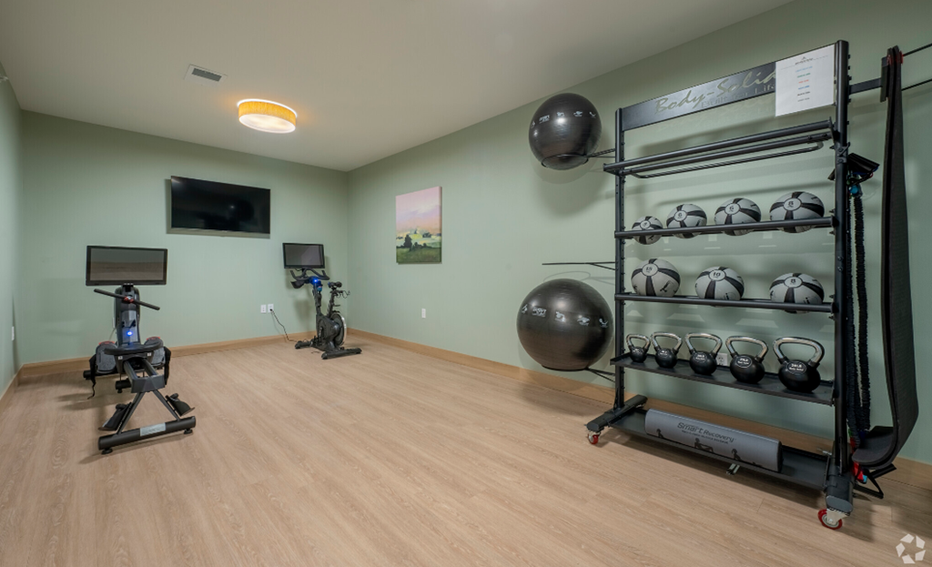 the gym at the flats at big tex apartments