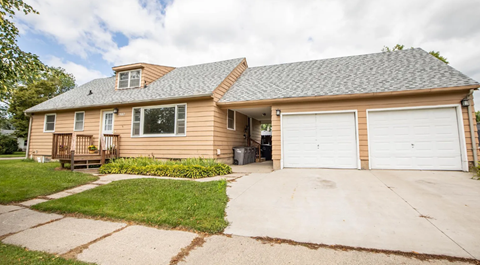 A two-car garage is attached to a house.