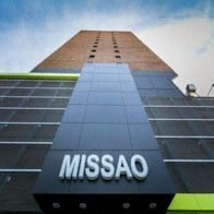 a tall building with the missasa logo on it