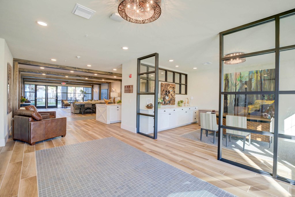 the living room is open to the dining room and kitchen