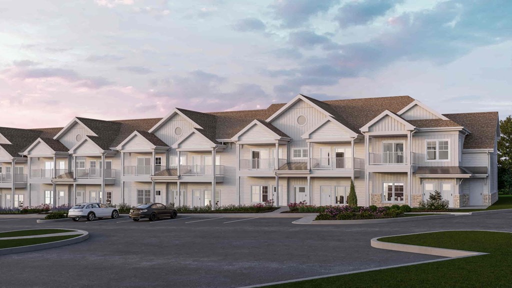 a rendering of an apartment building with a parking lot