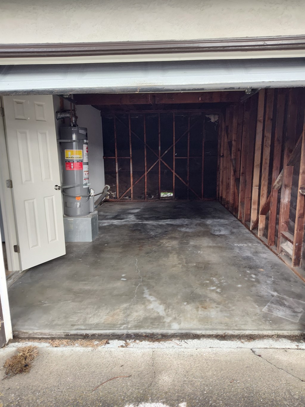 a garage with a concrete floor and a door