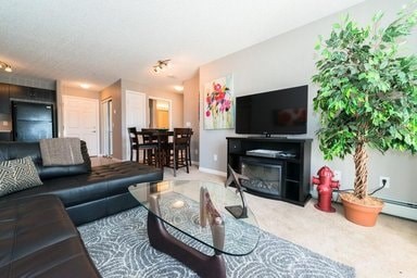 a living room with a couch a table and a television