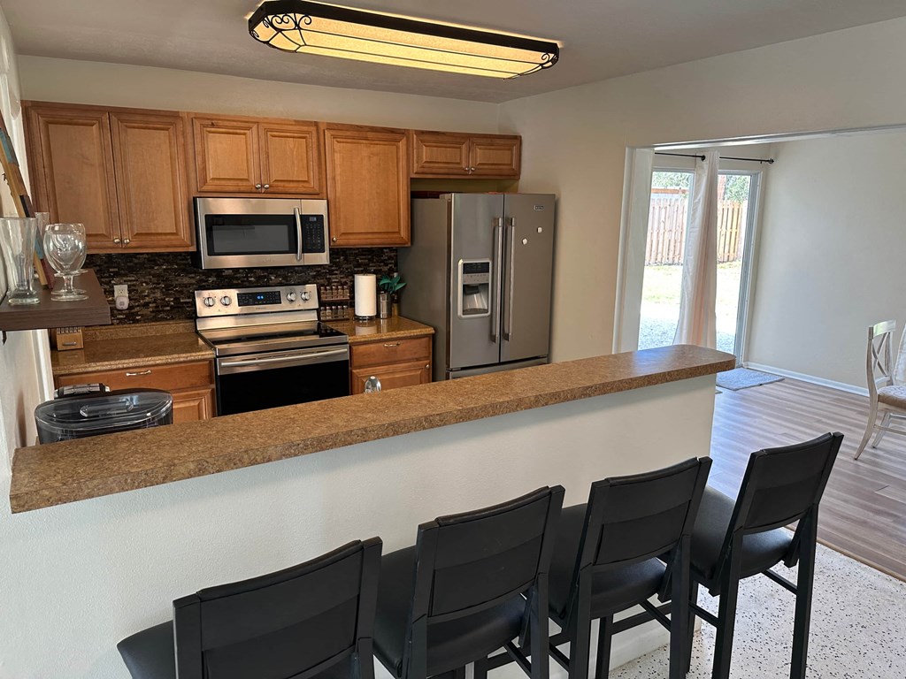a kitchen with a counter top and a refrigerator
