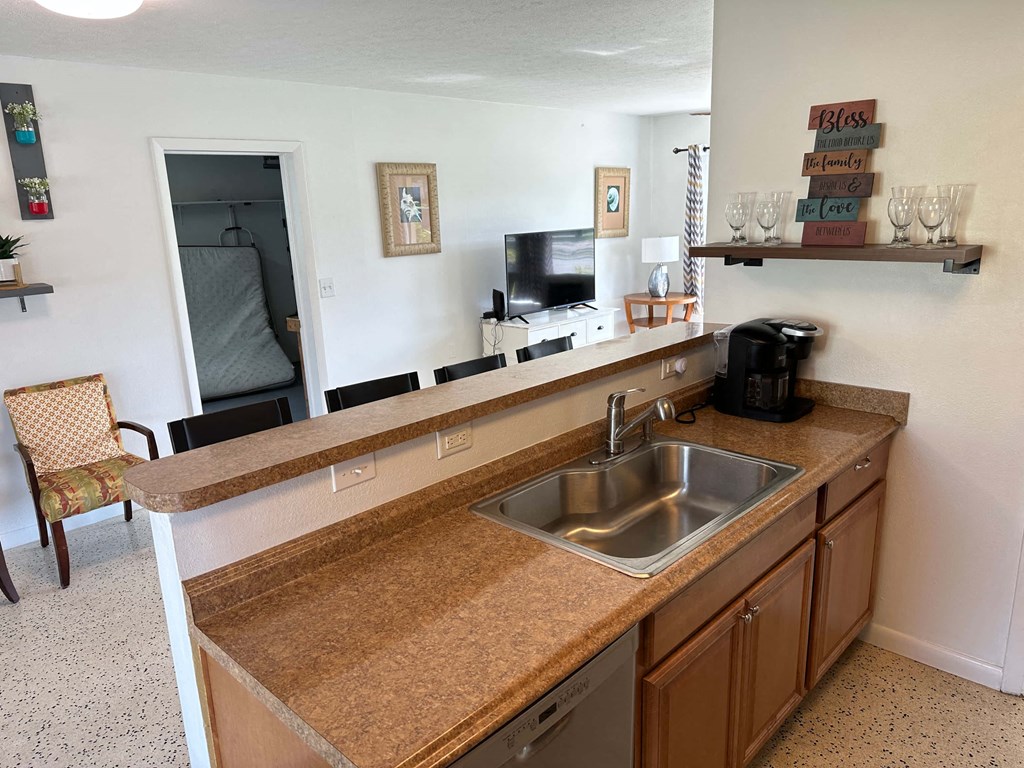 a kitchen with a sink and a counter top