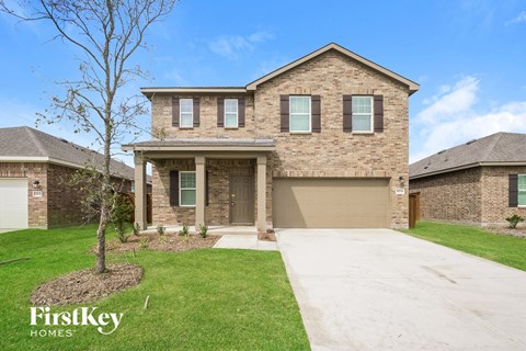 a brand new house with a sidewalk in front of it