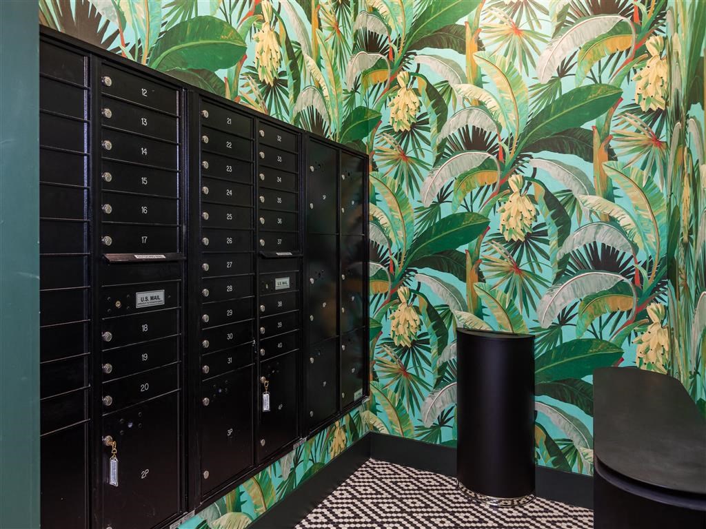 a locker room with a bunch of lockers and a wallpaper