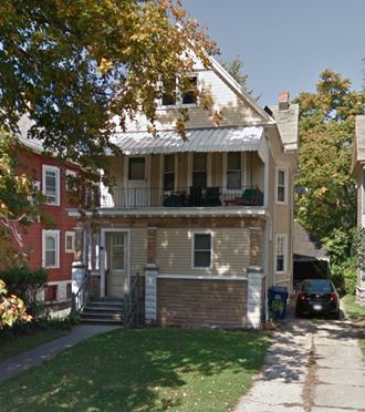 a house with a car parked in front of it