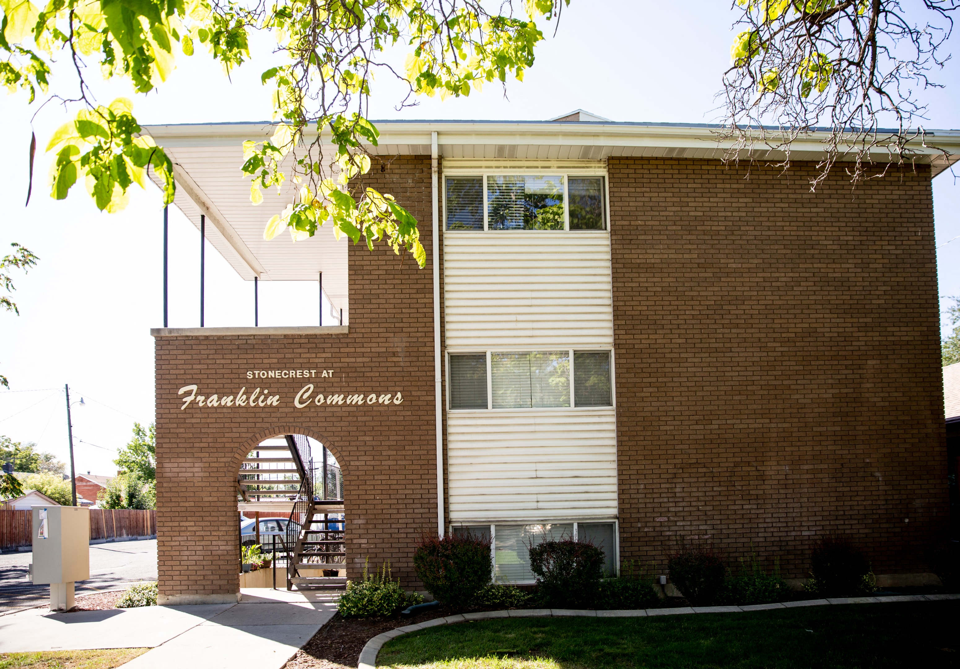 a brick building with a sign that reads pacific commons