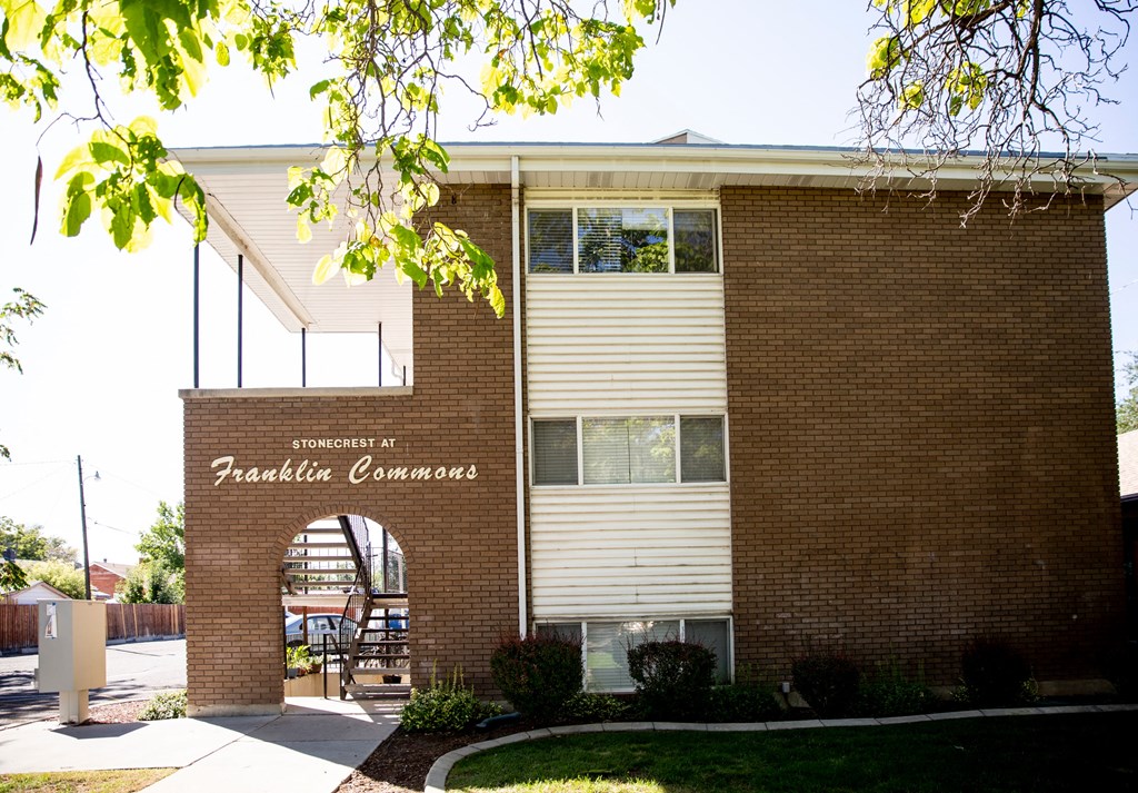 a brick building with a sign that reads pacific commons