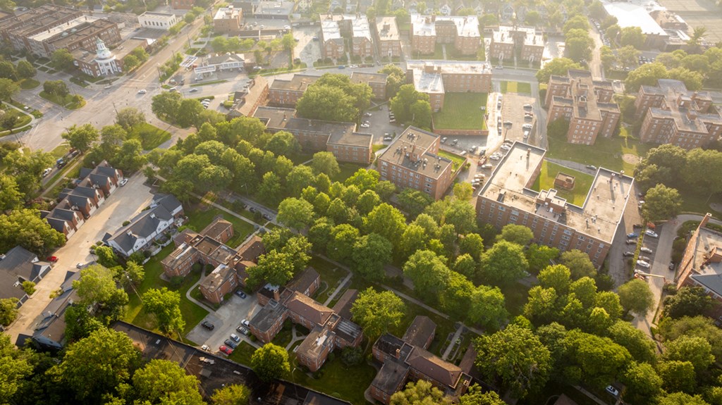an aerial view of a city with trees and buildings