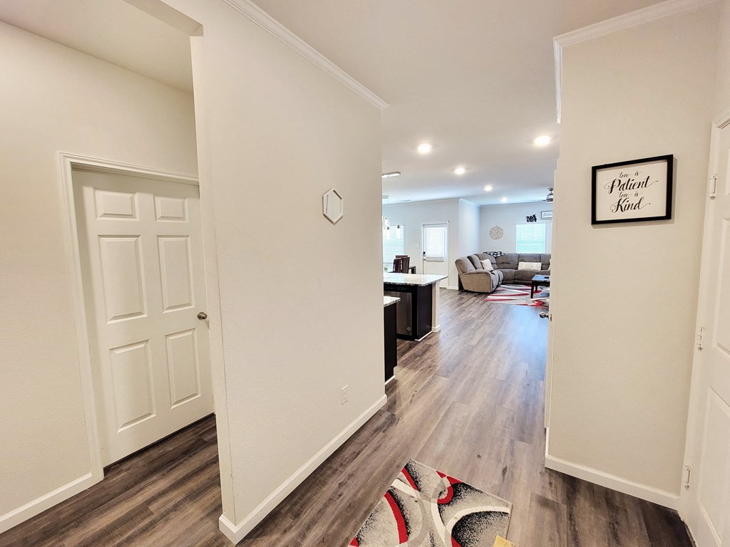 a renovated living room and kitchen in a new home
