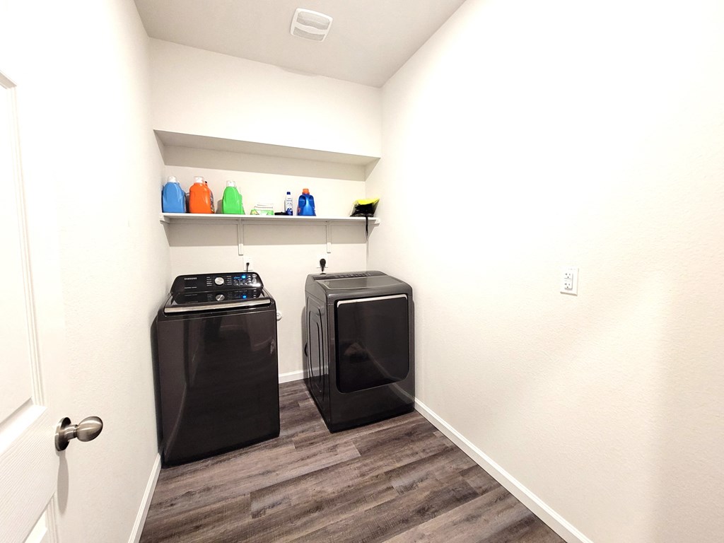 a small laundry room with a washer and dryer in it
