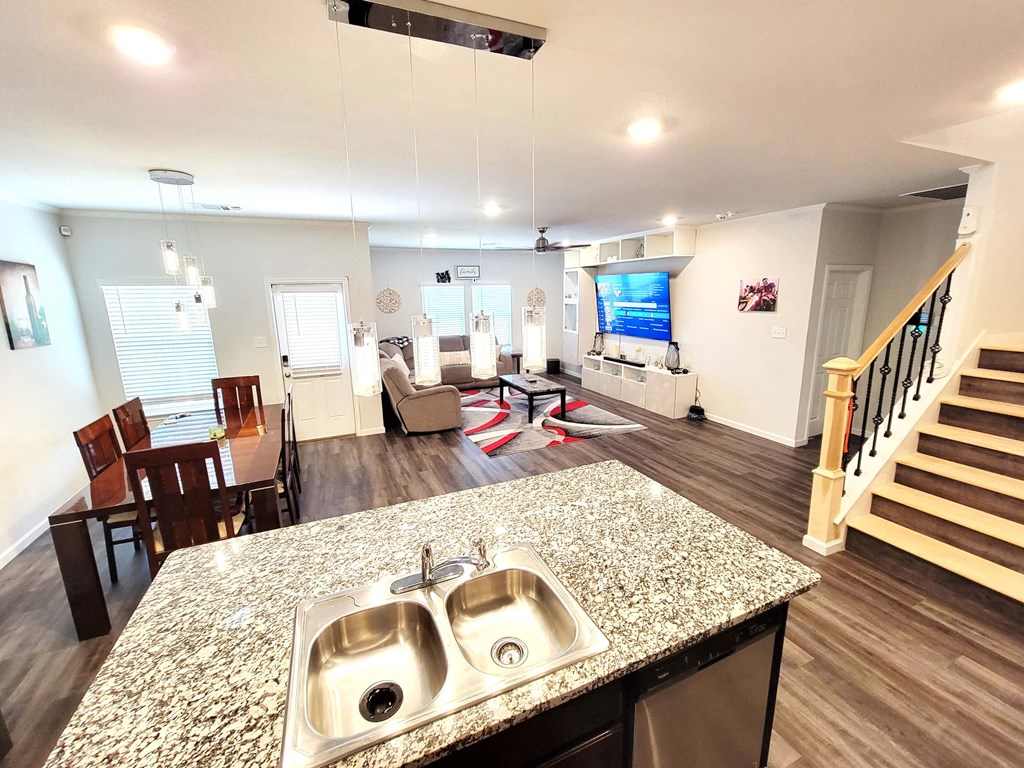 a view of the living room from the kitchen with a counter top