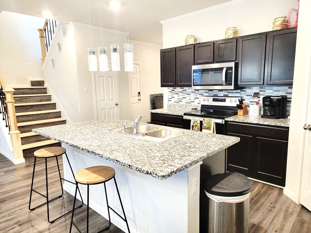 a kitchen with a counter top and a sink