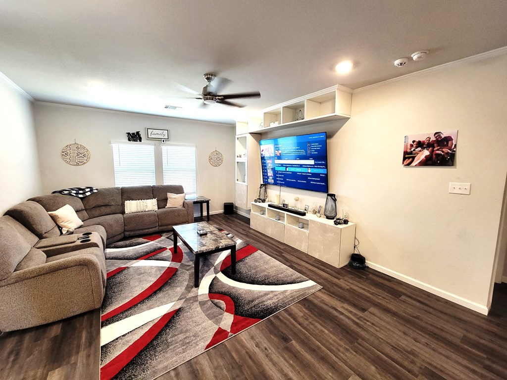 a living room with a couch and a tv